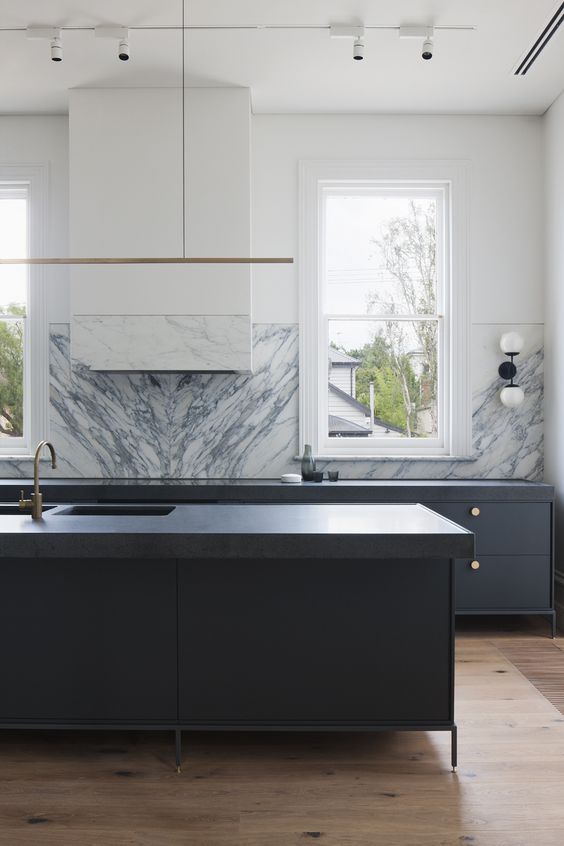 kitchen with no wall storage, freestanding island and base cabinets, statement marble backsplash book matched 