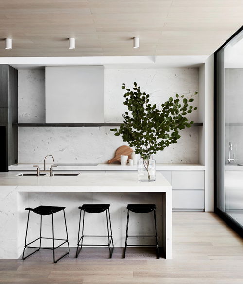 scandi minimal kitchen with single floating shelf and full height storage