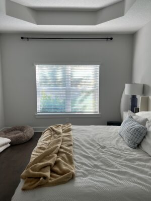 before image primary bedroom with small off-center window