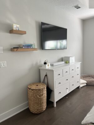 before image of primary bedroom with improperly scaled furniture